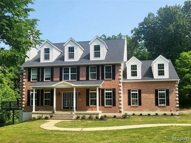 17917 Rosemar Ln, Wildwood, MO 63038 - view of front of home featuring brick siding, a front yard, and a porch
