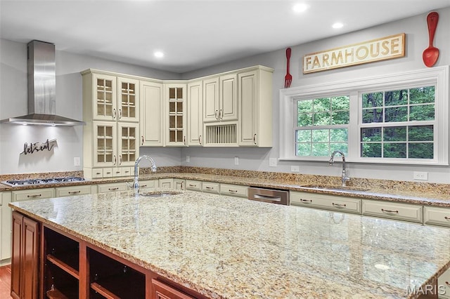 17917 Rosemar Ln, Wildwood, MO 63038 - kitchen featuring wall chimney exhaust hood, recessed lighting, light stone countertops, appliances with stainless steel finishes, and glass insert cabinets