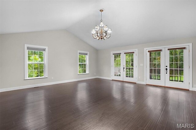 17917 Rosemar Ln, Wildwood, MO 63038 - unfurnished living room with french doors, a chandelier, healthy amount of natural light, vaulted ceiling, and dark wood-style floors