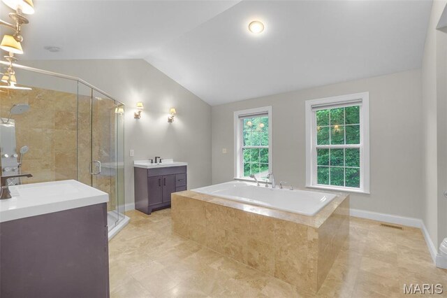 17917 Rosemar Ln, Wildwood, MO 63038 - full bathroom featuring vaulted ceiling, a bath, vanity, and a shower stall