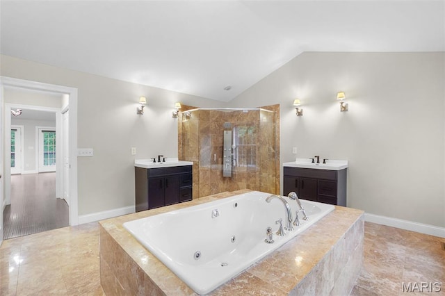 17917 Rosemar Ln, Wildwood, MO 63038 - full bathroom with a jetted tub, tiled shower, lofted ceiling, and vanity