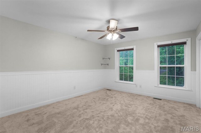 17917 Rosemar Ln, Wildwood, MO 63038 - empty room with a wainscoted wall, ceiling fan, and carpet floors