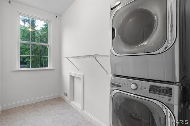 17917 Rosemar Ln, Wildwood, MO 63038 - laundry room with stacked washer / drying machine and baseboards