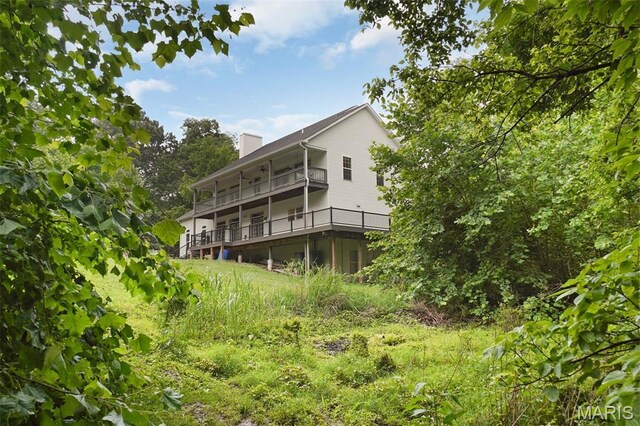 17917 Rosemar Ln, Wildwood, MO 63038 - back of property with a chimney and a balcony