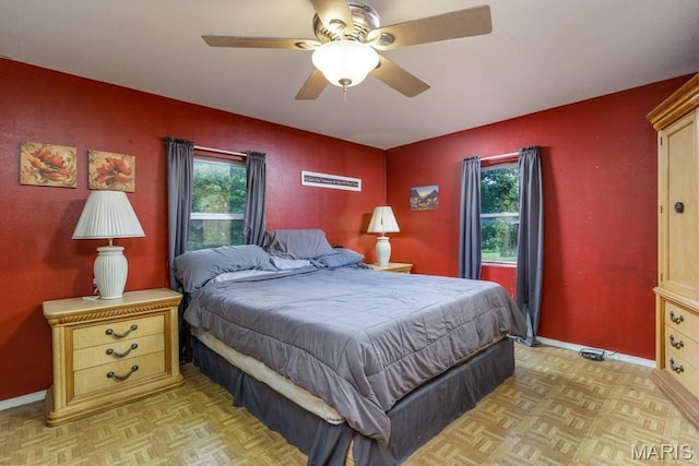 22250 Keepsake Rd, Lebanon, MO 65536 - bedroom featuring multiple windows, baseboards, and ceiling fan