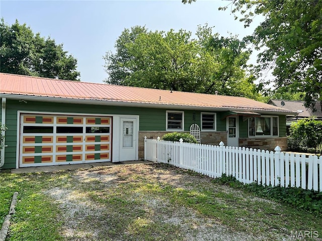 503 Cumberland St, Coffeen, IL 62017 - single story home featuring stone siding, metal roof, a garage, and driveway