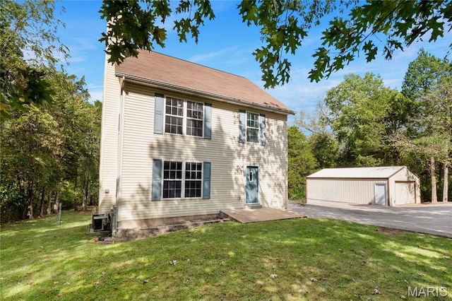 7611 State Route 30, Dittmer, MO 63023 - colonial home with a front yard, an outbuilding, a garage, and central air condition unit