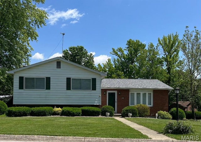 5001 Kingsmire Dr, Godfrey, IL 62035 - tri-level home with a front lawn and brick siding