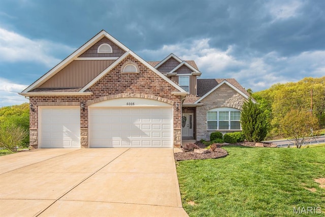 5005 Double Tree Dr, Imperial, MO 63052 - view of front facade featuring board and batten siding, concrete driveway, an attached garage, a front lawn, and stone siding