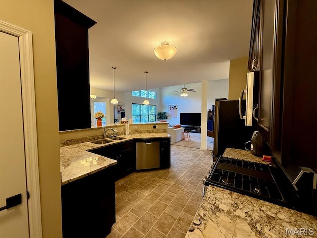 5005 Double Tree Dr, Imperial, MO 63052 - kitchen featuring stainless steel appliances, a sink, ceiling fan, open floor plan, and a peninsula