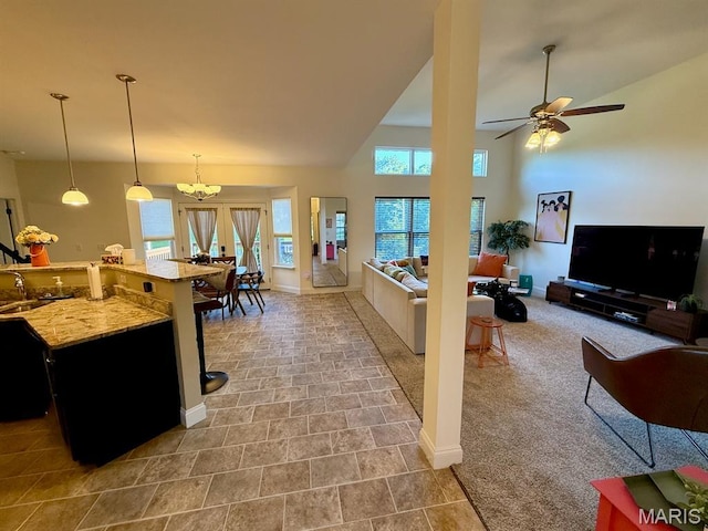 5005 Double Tree Dr, Imperial, MO 63052 - living area featuring ceiling fan, baseboards, and a high ceiling