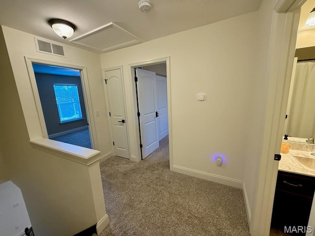 5005 Double Tree Dr, Imperial, MO 63052 - hallway with carpet, baseboards, and attic access