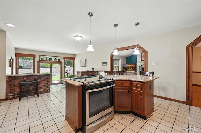 55 Cambrian Way, Saint Charles, MO 63301 - kitchen featuring stainless steel range with electric cooktop, light tile patterned floors, and healthy amount of natural light