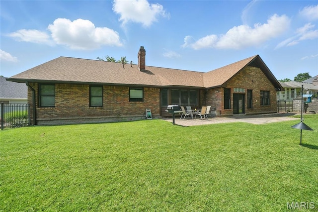 55 Cambrian Way, Saint Charles, MO 63301 - back of house featuring brick siding, a patio area, a chimney, and roof with shingles