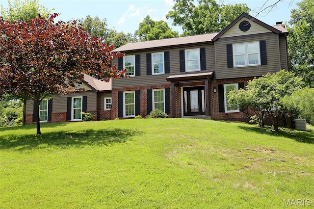 2003 Centennial Ct, Wildwood, MO 63011 - view of front of house with brick siding, a front yard, and a chimney