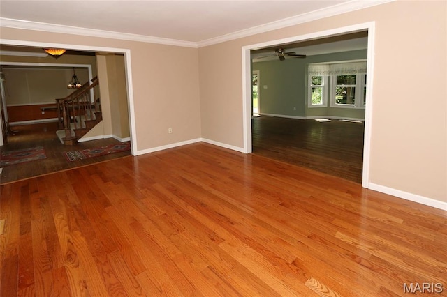2003 Centennial Ct, Wildwood, MO 63011 - spare room with stairway, crown molding, wood finished floors, and a chandelier