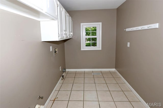 2003 Centennial Ct, Wildwood, MO 63011 - laundry room with cabinet space, light tile patterned flooring, and washer hookup