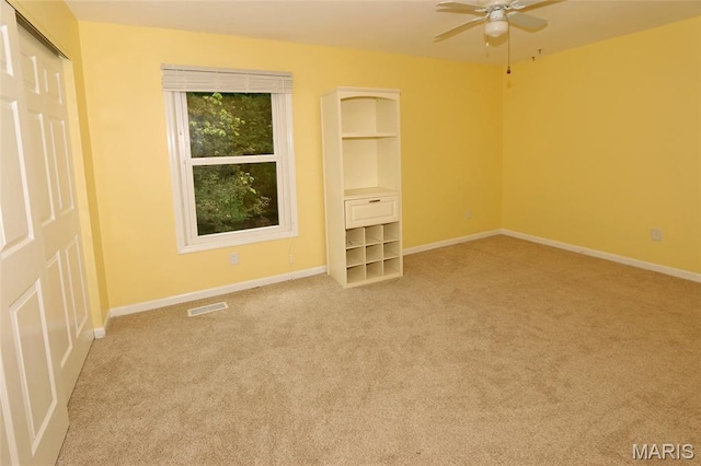 2003 Centennial Ct, Wildwood, MO 63011 - empty room with light carpet, a ceiling fan, and built in features