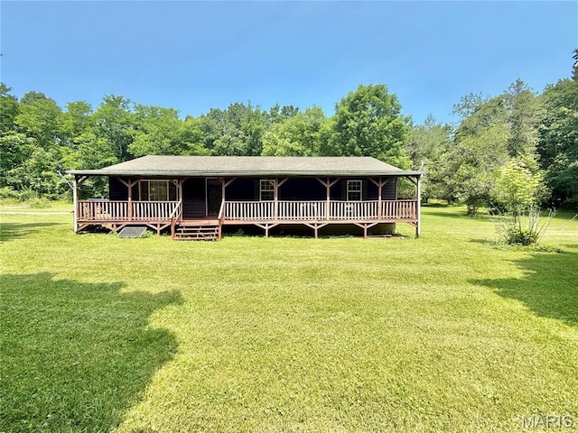 720 S Main St, Arcadia, MO 63621 - view of front of property featuring a front lawn, a wooden deck, and view of wooded area