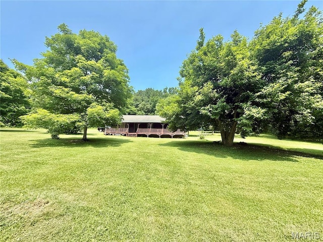 720 S Main St, Arcadia, MO 63621 - view of grassy yard with a deck