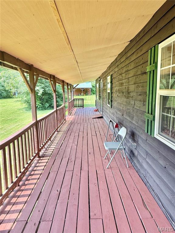 720 S Main St, Arcadia, MO 63621 - wooden deck with a lawn