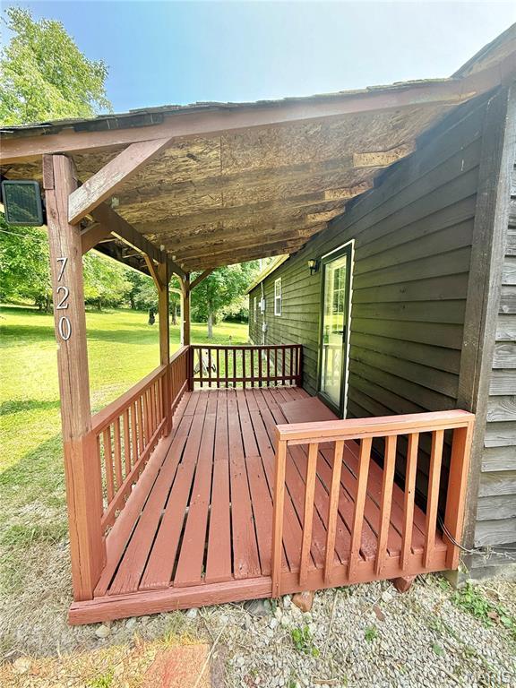 720 S Main St, Arcadia, MO 63621 - wooden deck with a lawn