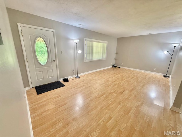 720 S Main St, Arcadia, MO 63621 - foyer with light wood-style floors and baseboards