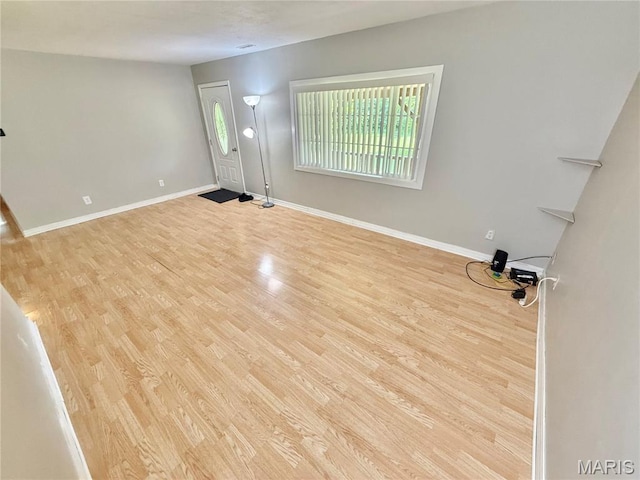 720 S Main St, Arcadia, MO 63621 - foyer featuring wood finished floors and baseboards