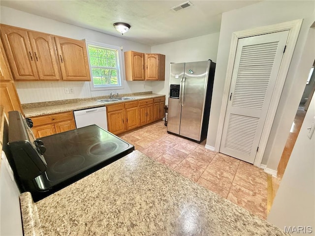 720 S Main St, Arcadia, MO 63621 - kitchen featuring stainless steel refrigerator with ice dispenser, white dishwasher, black electric range, light countertops, and a sink