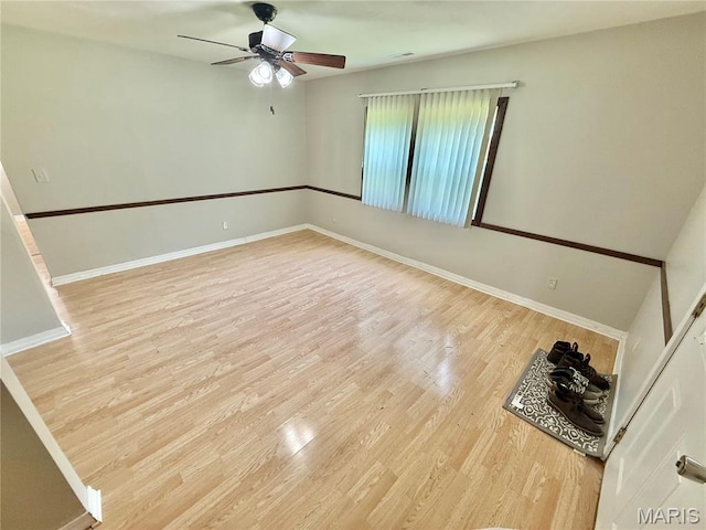 720 S Main St, Arcadia, MO 63621 - spare room with a ceiling fan, light wood-type flooring, and baseboards