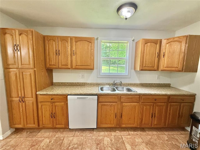 720 S Main St, Arcadia, MO 63621 - kitchen with dishwasher, a sink, light countertops, and brown cabinets