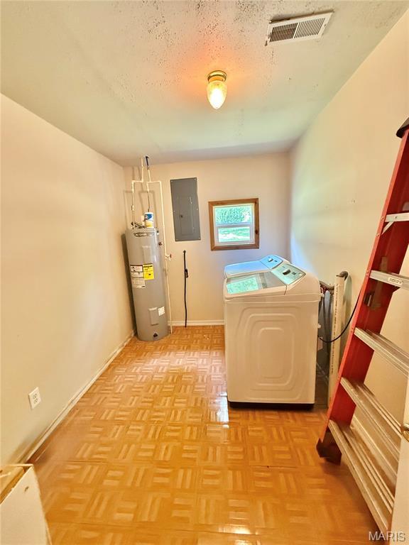 720 S Main St, Arcadia, MO 63621 - laundry area featuring water heater, electric panel, a textured ceiling, baseboards, and washing machine and dryer