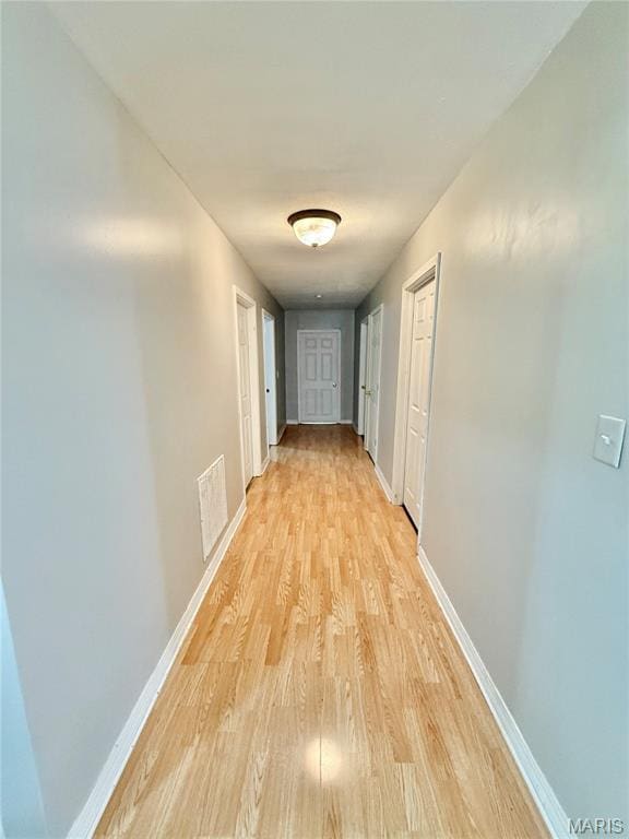 720 S Main St, Arcadia, MO 63621 - hallway featuring light wood finished floors and baseboards
