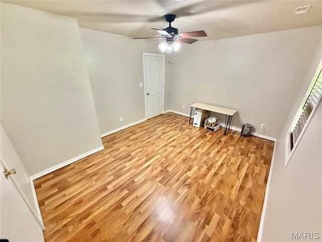 720 S Main St, Arcadia, MO 63621 - spare room featuring ceiling fan, light wood finished floors, and baseboards