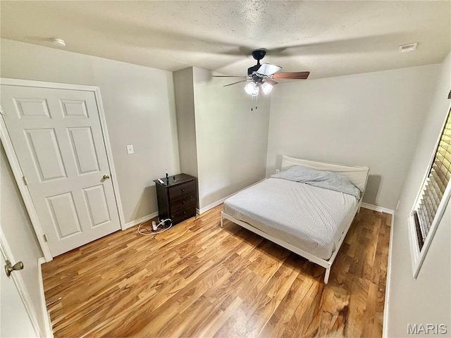 720 S Main St, Arcadia, MO 63621 - bedroom featuring light wood finished floors, baseboards, and a ceiling fan