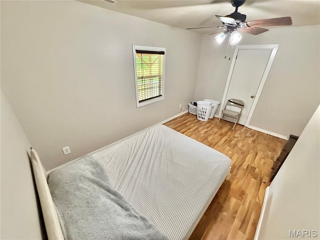 720 S Main St, Arcadia, MO 63621 - bedroom featuring light wood-style floors, baseboards, and ceiling fan