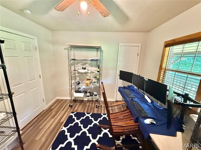 720 S Main St, Arcadia, MO 63621 - home office with a ceiling fan, wood finished floors, and baseboards