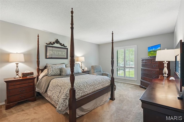 564 Sarah Ln Unit 103, Creve Coeur, MO 63141 - bedroom with light colored carpet, baseboards, and a textured ceiling
