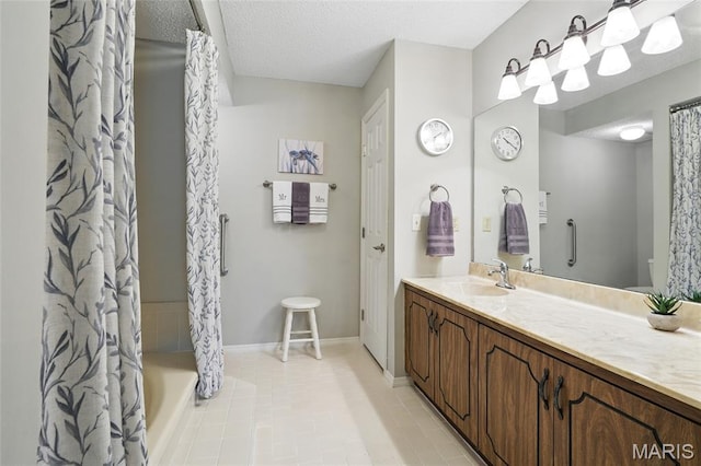 564 Sarah Ln Unit 103, Creve Coeur, MO 63141 - bathroom featuring vanity, tile patterned flooring, toilet, shower / bath combo with shower curtain, and baseboards