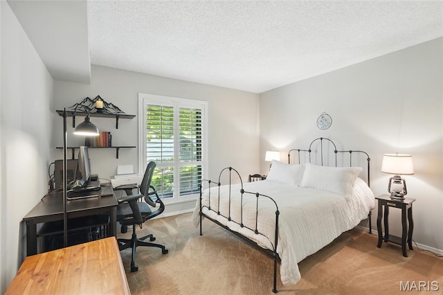 564 Sarah Ln Unit 103, Creve Coeur, MO 63141 - carpeted bedroom with an office area, baseboards, and a textured ceiling