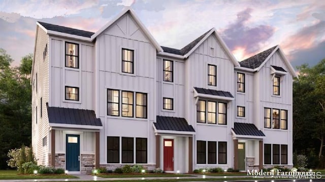 8923 Gateway Hts Unit 94-805, Richmond Heights, MO 63144 - townhome / multi-family property featuring a standing seam roof, board and batten siding, and metal roof