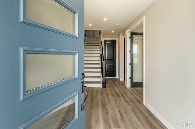 8923 Gateway Hts Unit 94-805, Richmond Heights, MO 63144 - hallway featuring baseboards, wood finished floors, stairway, and recessed lighting
