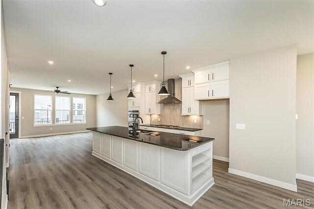 8923 Gateway Hts Unit 94-805, Richmond Heights, MO 63144 - kitchen featuring wall chimney exhaust hood, dark countertops, wood finished floors, baseboards, and open shelves
