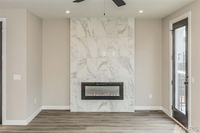 8923 Gateway Hts Unit 94-805, Richmond Heights, MO 63144 - detailed view of ceiling fan, heating unit, a tile fireplace, recessed lighting, and wood finished floors