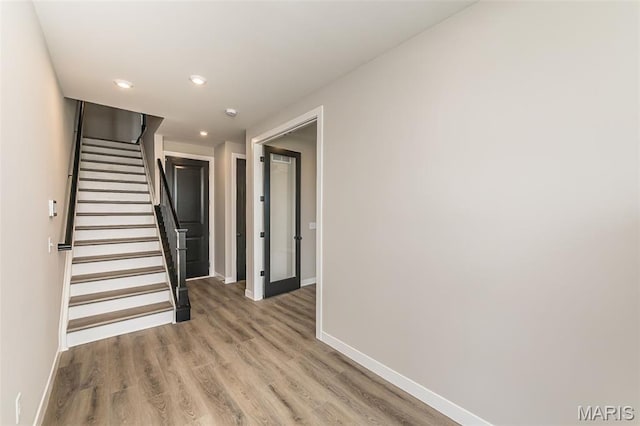 8923 Gateway Hts Unit 94-805, Richmond Heights, MO 63144 - staircase featuring baseboards, wood finished floors, and recessed lighting