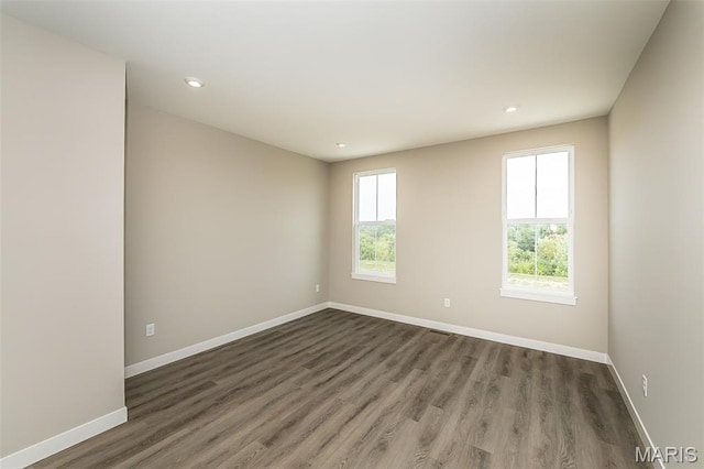 8923 Gateway Hts Unit 94-805, Richmond Heights, MO 63144 - spare room with baseboards, wood finished floors, and recessed lighting