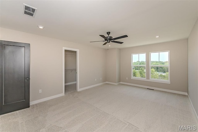 8923 Gateway Hts Unit 94-805, Richmond Heights, MO 63144 - unfurnished bedroom with carpet floors, baseboards, recessed lighting, a walk in closet, and a ceiling fan