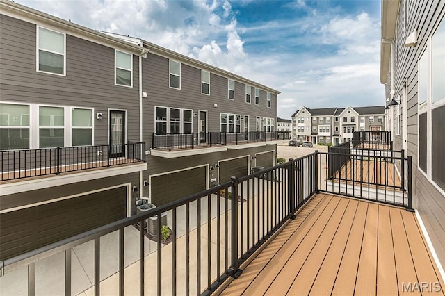 8923 Gateway Hts Unit 94-805, Richmond Heights, MO 63144 - wooden terrace with a residential view and a garage