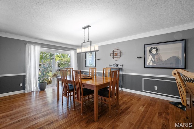 116 Lea Meadows Dr, Ballwin, MO 63011 - dining area with a textured ceiling, wood finished floors, crown molding, and baseboards