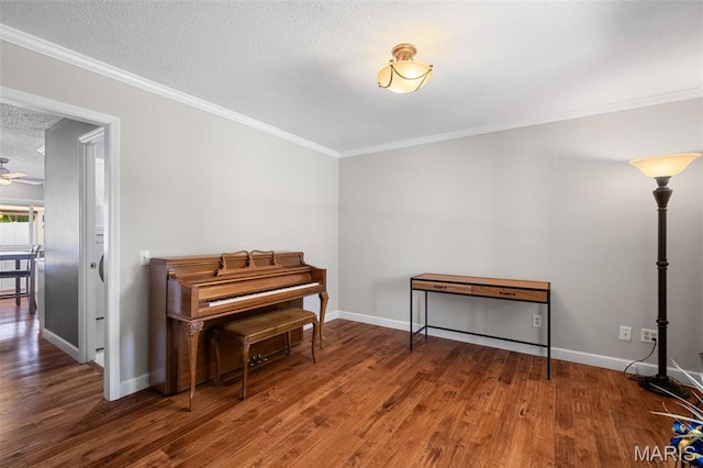 116 Lea Meadows Dr, Ballwin, MO 63011 - sitting room featuring a textured ceiling, wood finished floors, ornamental molding, and baseboards